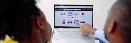 Close-up Of A Couple Using Laptop For Shopping Onlineの写真素材