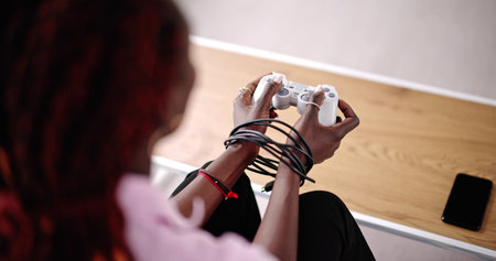 Video Game Addiction. Wire And Gamepad Or Joystickの写真素材