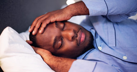 Young African Man Suffering From Fever Lying On Bed