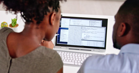 African American Coder Using Computer At Desk. Web Developerの写真素材
