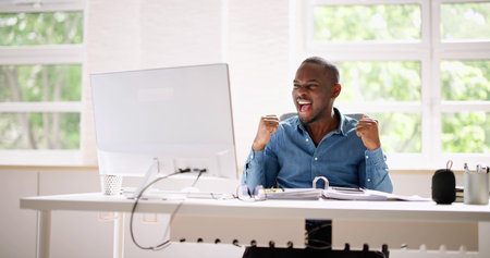 Happy African American Stock Trader Business Man With Computerの写真素材