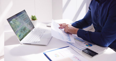 Business Accountant Using Finance Chart Document And Calculatorの写真素材