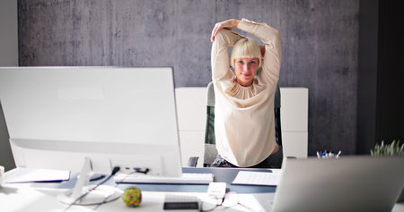 Stretch Exercise Workout At Office Business Deskの写真素材