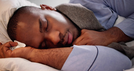 Sick Man Sleeping In Bed To Restの写真素材