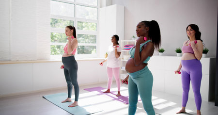 Diverse Pregnant Group Gym Fitness Exercise And Prenatal Trainingの写真素材