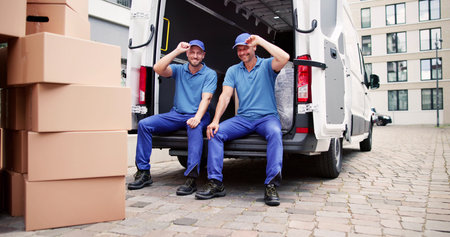 Furniture Removal Men. Relocation Delivery Truck On Streetの写真素材