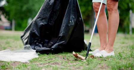 Garbage Removal Woman Doing Trash And Rubbish Collectionの写真素材
