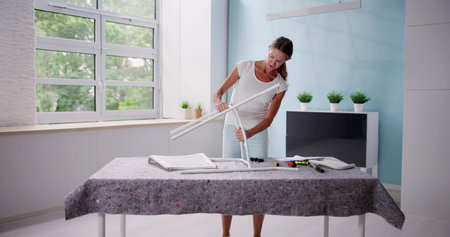 Home Improvement Assembling New Furniture. Confused Womanの写真素材