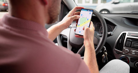 Car With GPS Navigation Maps On Mobile Phone Touchscreen