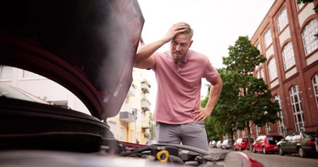 Broken Down Car. Frustrated Man Looking At Smokeの写真素材