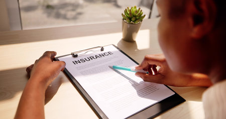 American African Agent Showing Company Insurance Policy Document