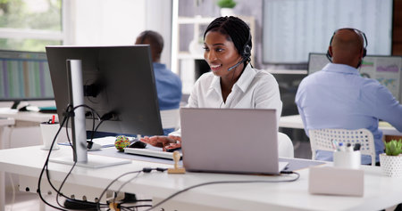 Portrait Of A Smiling African Female Customer Service Executive
