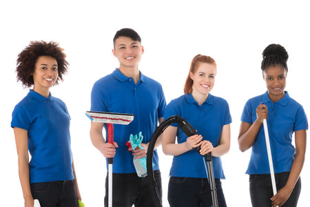 Group Of Happy Janitors With Cleaning Equipmentの写真素材