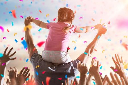 Little Girl On Dads Shoulders At Celebration Eventの写真素材