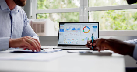 Financial Data Analysts Working In Office With Documents