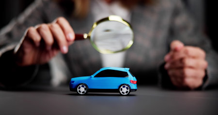 Hand Repair Using a Magnifying Glass and Magnifierの写真素材