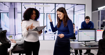 Angry Employee Mobbing Someone At Corporation. Female Employees Fightingの写真素材