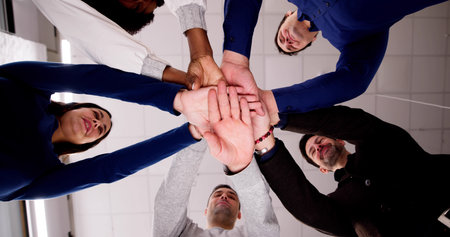 Professional Business Team Huddle And Hands. Diverse Group Management
