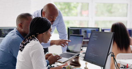 African developer team working on computer code for businessの写真素材