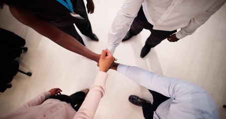 Business People Putting Their Hands Together In Stack