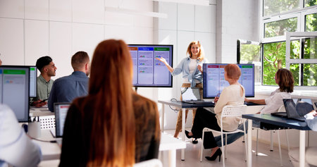 Corporate Training In A Black Classroom With Computer Background