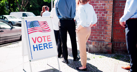 Diverse People At Voting Booth. Vote Here Elections Sign