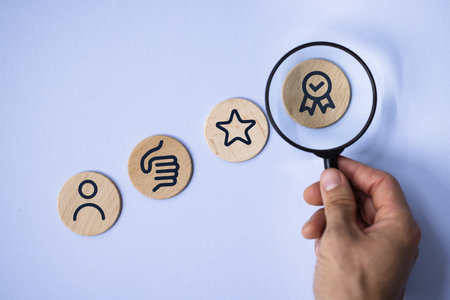 Quality Assurance Certificate: A businessman using a magnifying glass to inspect a wooden plaque representing corporate standards and compliance.の写真素材
