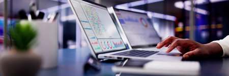 Female African American Data Analyst Predicting Market Trends on Virtual KPI Dashboard in Emerging...