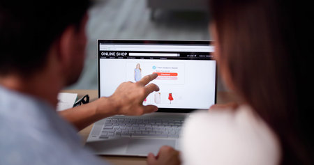 Couple Retail Shopping On Laptop. Consumer Ecommerceの写真素材