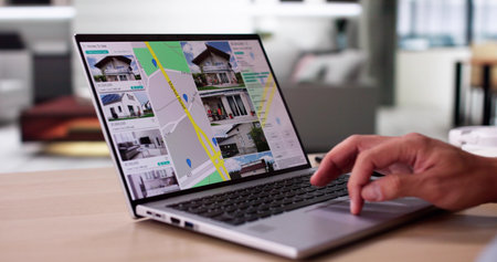 Online Real Estate Location Search. Man Renting Apartmentの写真素材