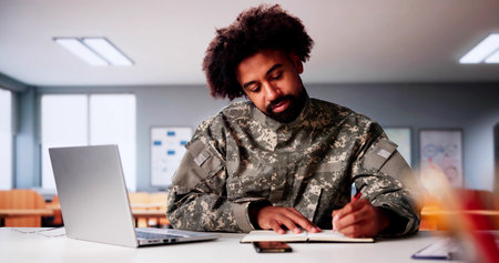 Military Student Education. Army Soldier Veteran With Computerの写真素材