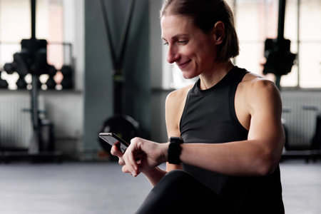 Fitness Gym Workout. Athlete Woman Checking Smart watch