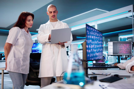 Medical Lab Scientist Woman Doing Research In Laboratory Using Microscopeの写真素材