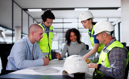 Construction Engineer Meeting With Business People In Office