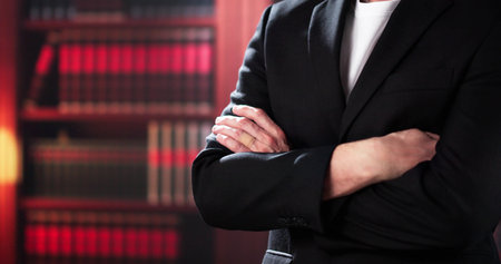 Male Attorney With Arms Crossed. Lawyer In Officeの写真素材
