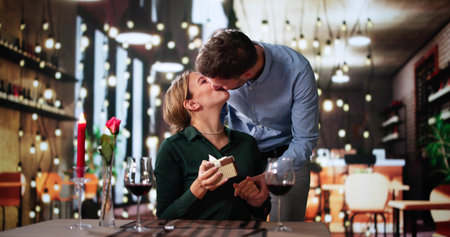 Romantic Couple Sitting Having Dinner In An Elegant Restaurantの写真素材