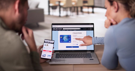 Happy Young Couple Shopping Online Using Laptop And Credit Card