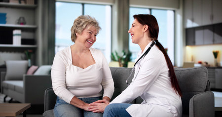 Elderly Patient Care. Caregiver Holding Woman Handsの写真素材