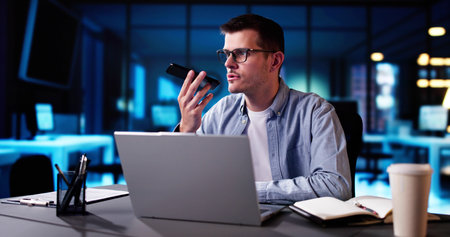 Business Man Talking On Phone Near Computer