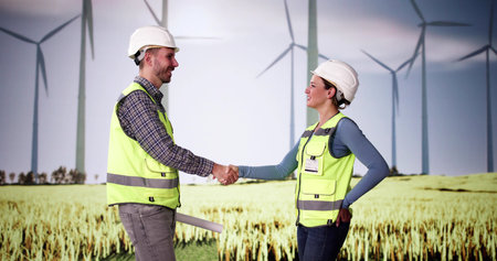 Wind Engineers Shaking Hands. Sustainable Windmill Power Team Work Success