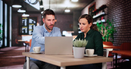 Coworkers Using Technology Lifestyle. Man And Woman Drinking Coffee In Cafe