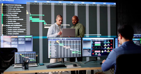 Multiracial Man Using Gantt Software to Schedule Virtual Meetings