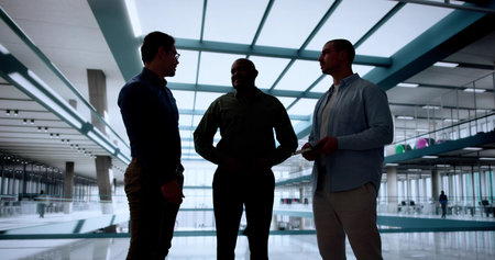 Diverse group of colleagues collaborate in office meeting for strategy.