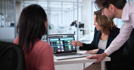 Professional Team Analyzing Billing Report Using Spreadsheet Software in Office Setting.