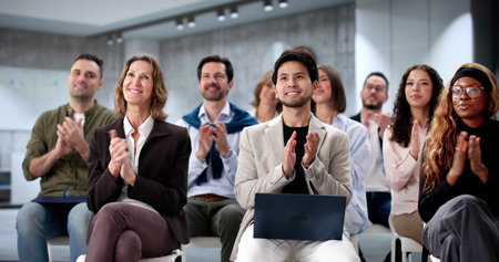 Diverse group of business professionals actively participating in a conference.の写真素材