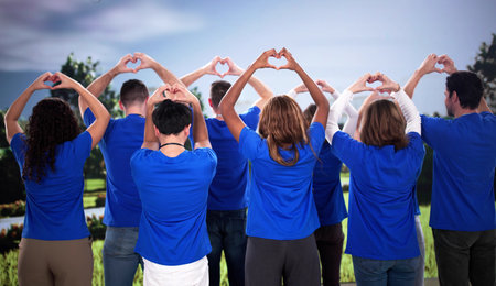 Multiracial volunteers create hearts, spreading love in local communities worldwide.の写真素材