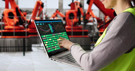 Female Engineer Supervising Production Line at Automotive Manufacturing Plant Factory
