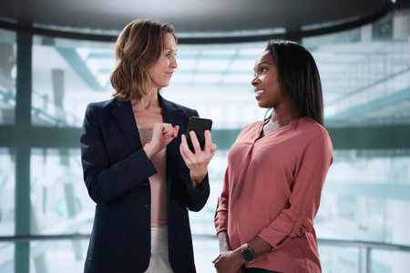 African American woman giving career pitch in elevator conversationの写真素材