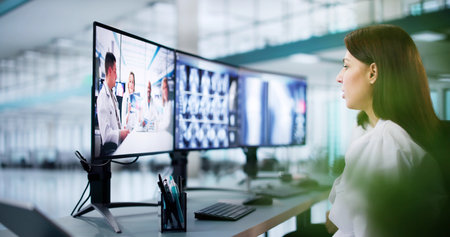Virtual Medical Consultation: Woman Doctor Conducts Online Radiology Training Sessionの写真素材