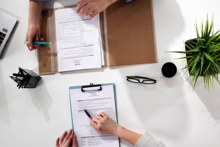 female recruitment consultant meets with a potential hire in office.の写真素材